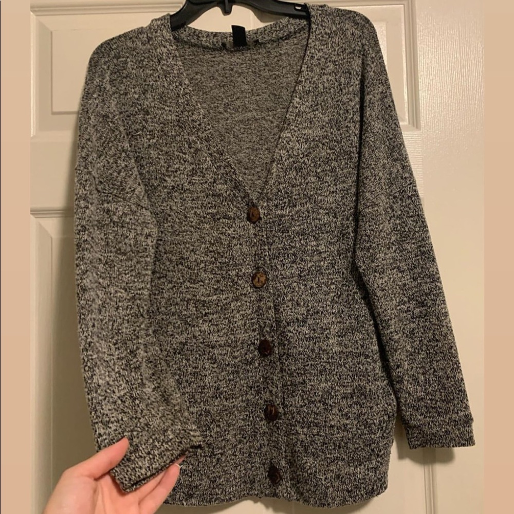 Cardigan sweater with functional buttons